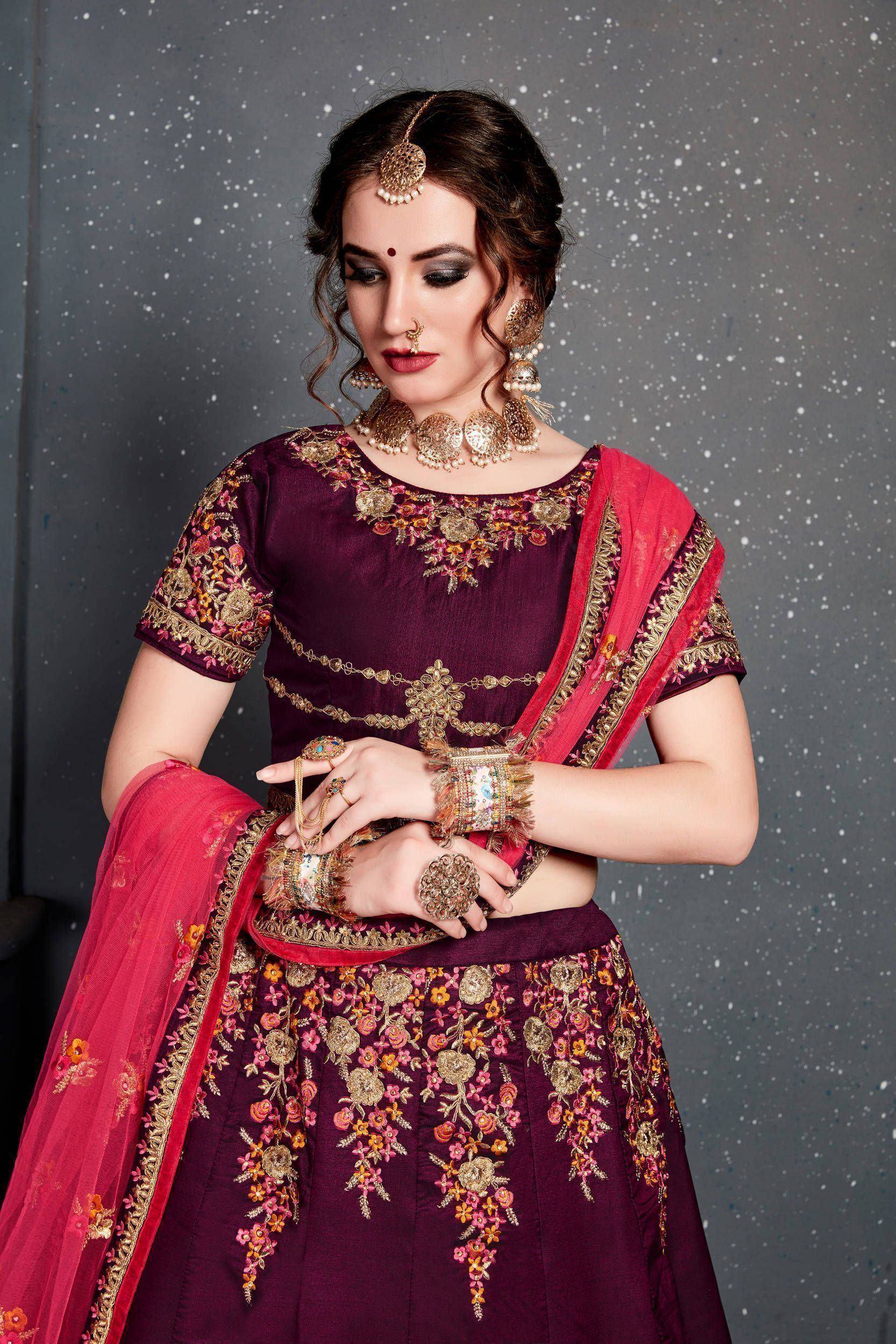 Elegant maroon lehenga choli with floral embroidery and pink dupatta, perfect for Indian ethnic occasions.