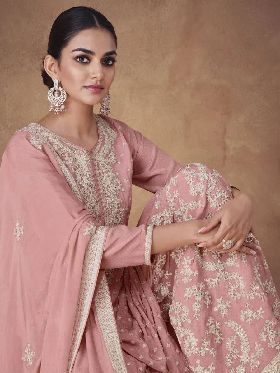 Pink embroidered salwar kameez with gold detailing, perfect for Indian ethnic wear occasions