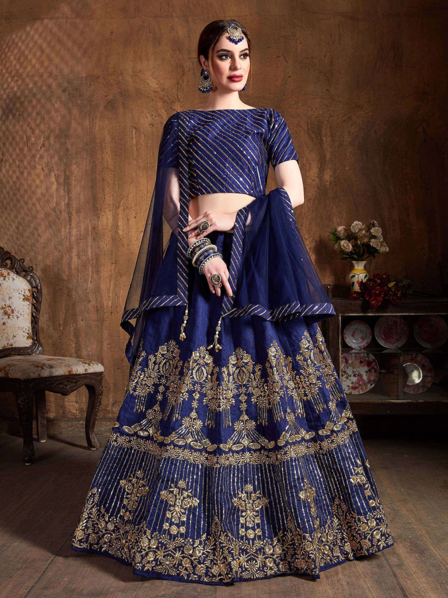 Royal blue lehenga choli with gold embroidery, perfect for Indian weddings and festive occasions.
