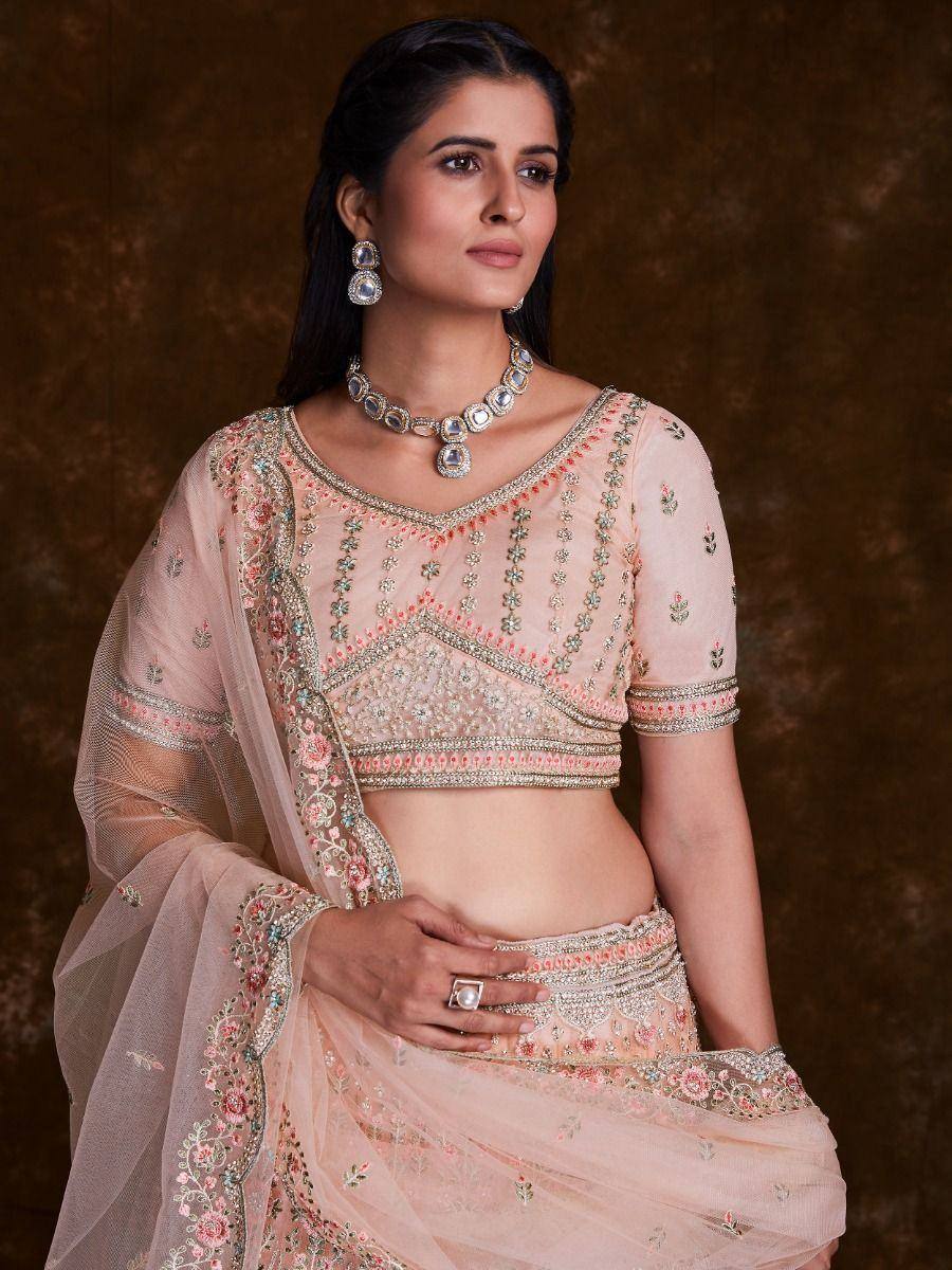 Pink embroidered lehenga choli with floral detailing and matching dupatta, perfect for Indian weddings and festive occasions.