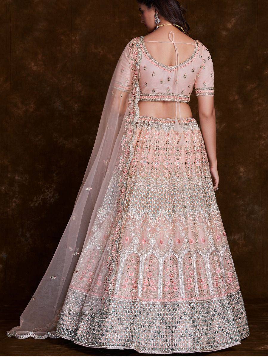 Pink embroidered lehenga choli with sheer dupatta, perfect for Indian weddings and festive occasions