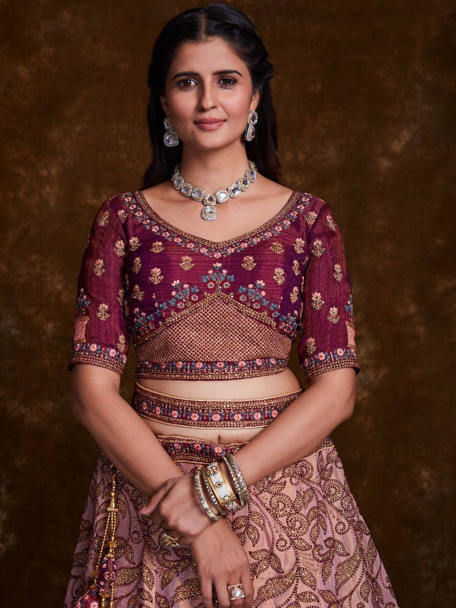 Maroon embroidered lehenga choli with gold detailing, perfect for Indian ethnic wear and festive occasions