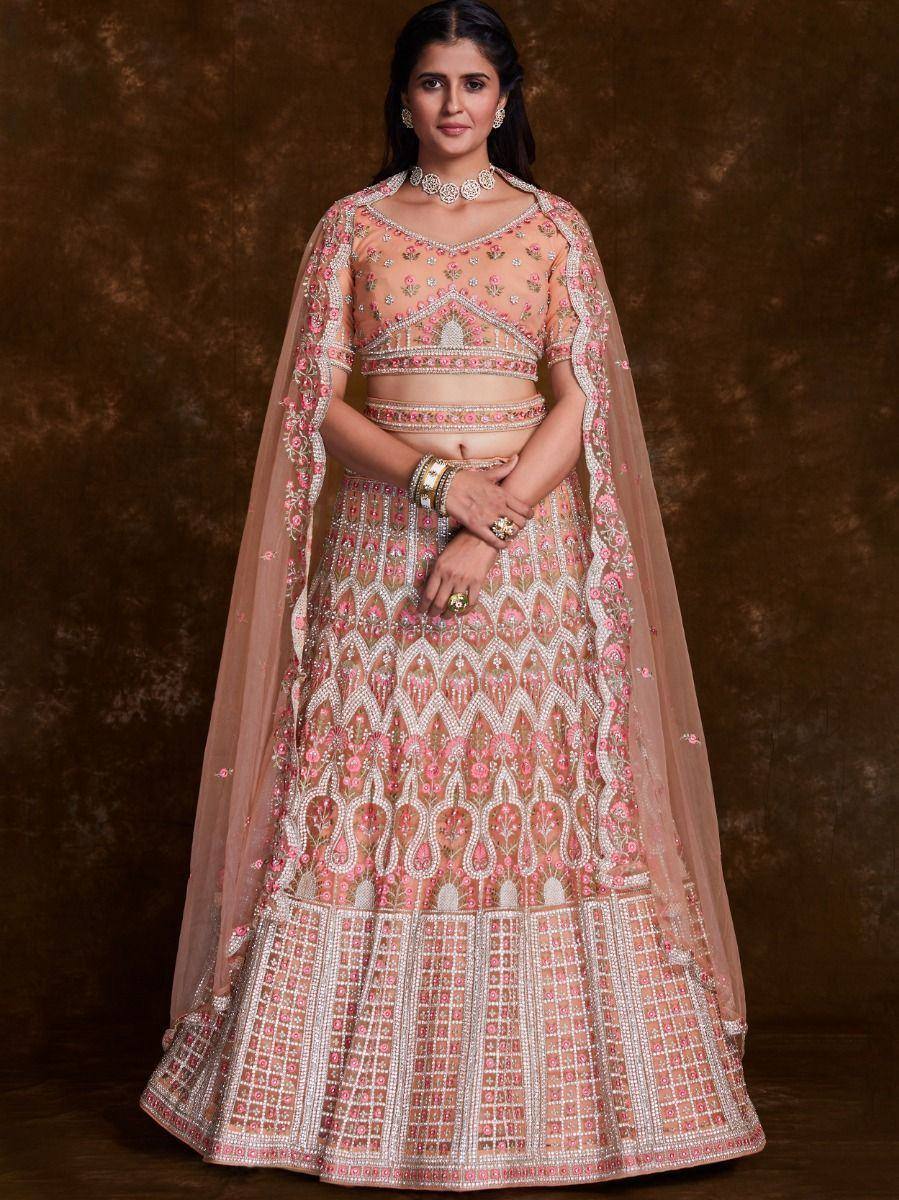 Pink and gold embroidered lehenga choli with sheer dupatta, perfect for Indian weddings and festive occasions