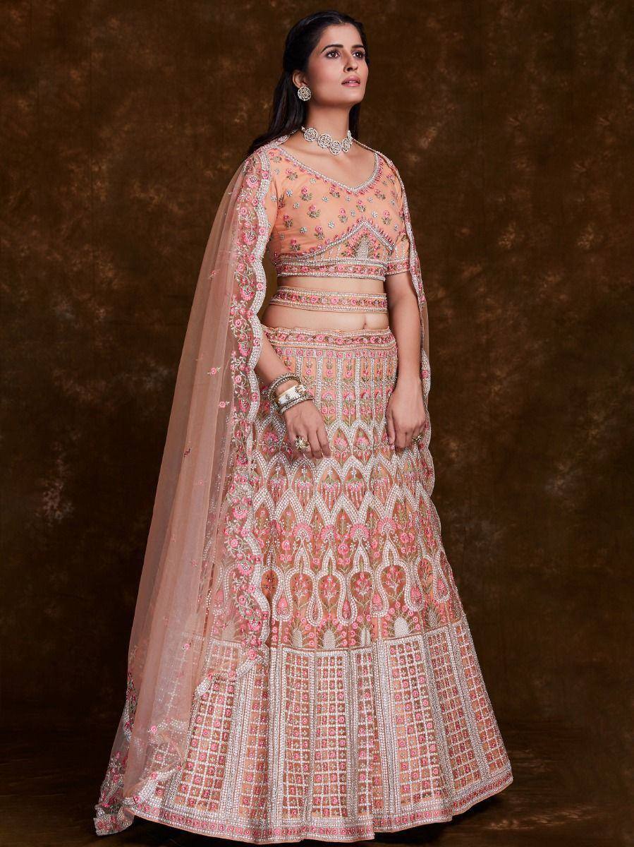 Pink embroidered lehenga choli with floral motifs and sheer dupatta, perfect for Indian weddings and festive occasions
