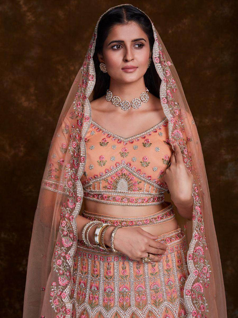 Blossoming Peach Embroidered Soft Net Wedding Lehenga Choli