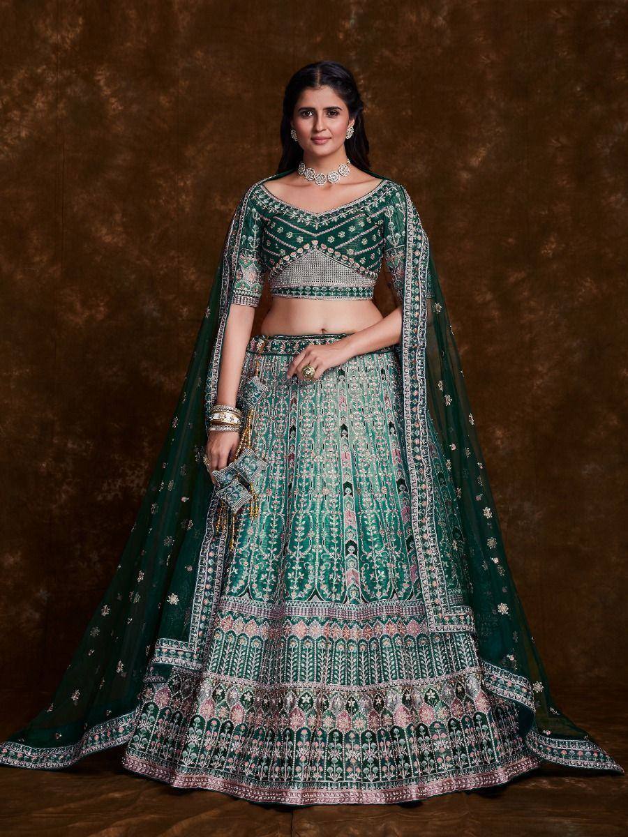 Emerald green designer lehenga choli with intricate embroidery and matching dupatta for Indian ethnic wear