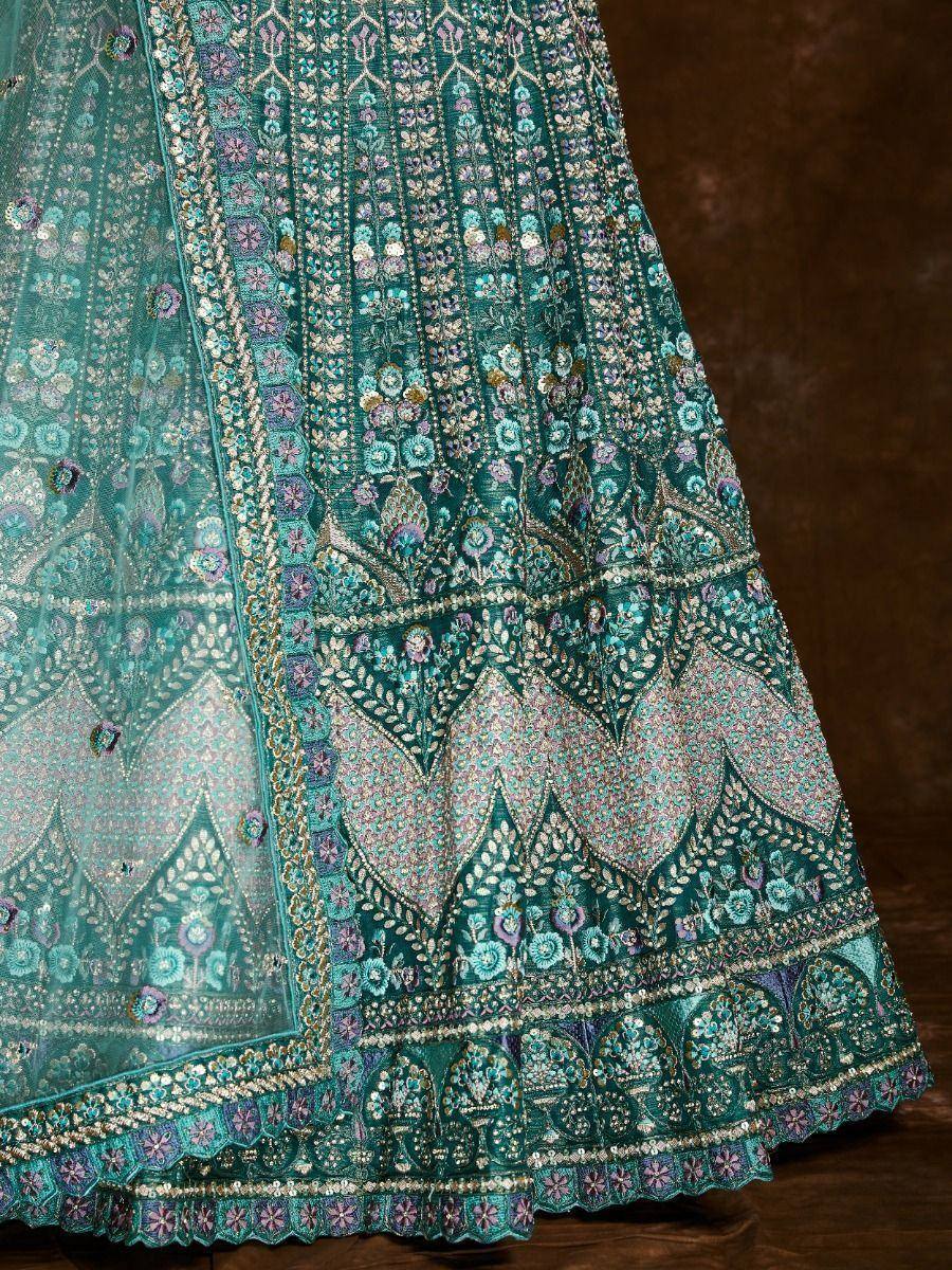Teal embroidered lehenga with floral motifs and intricate border detailing for Indian ethnic wear