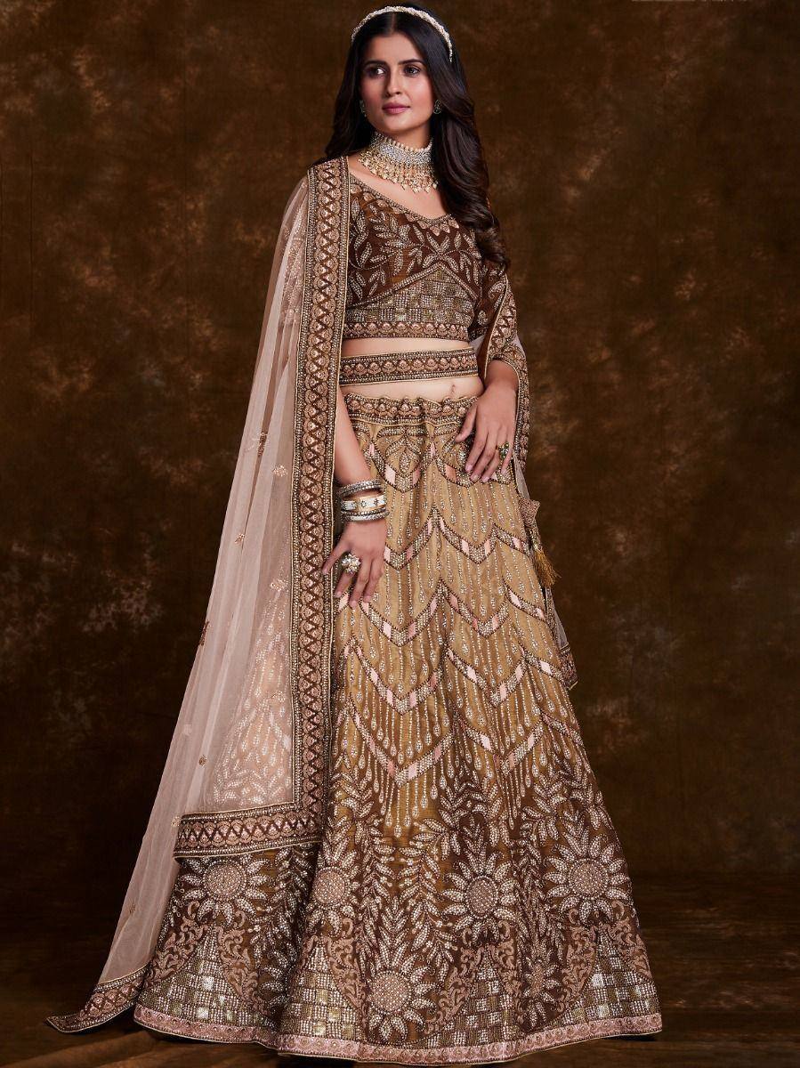 Designer gold and brown lehenga choli with intricate embroidery and dupatta, perfect for Indian weddings.