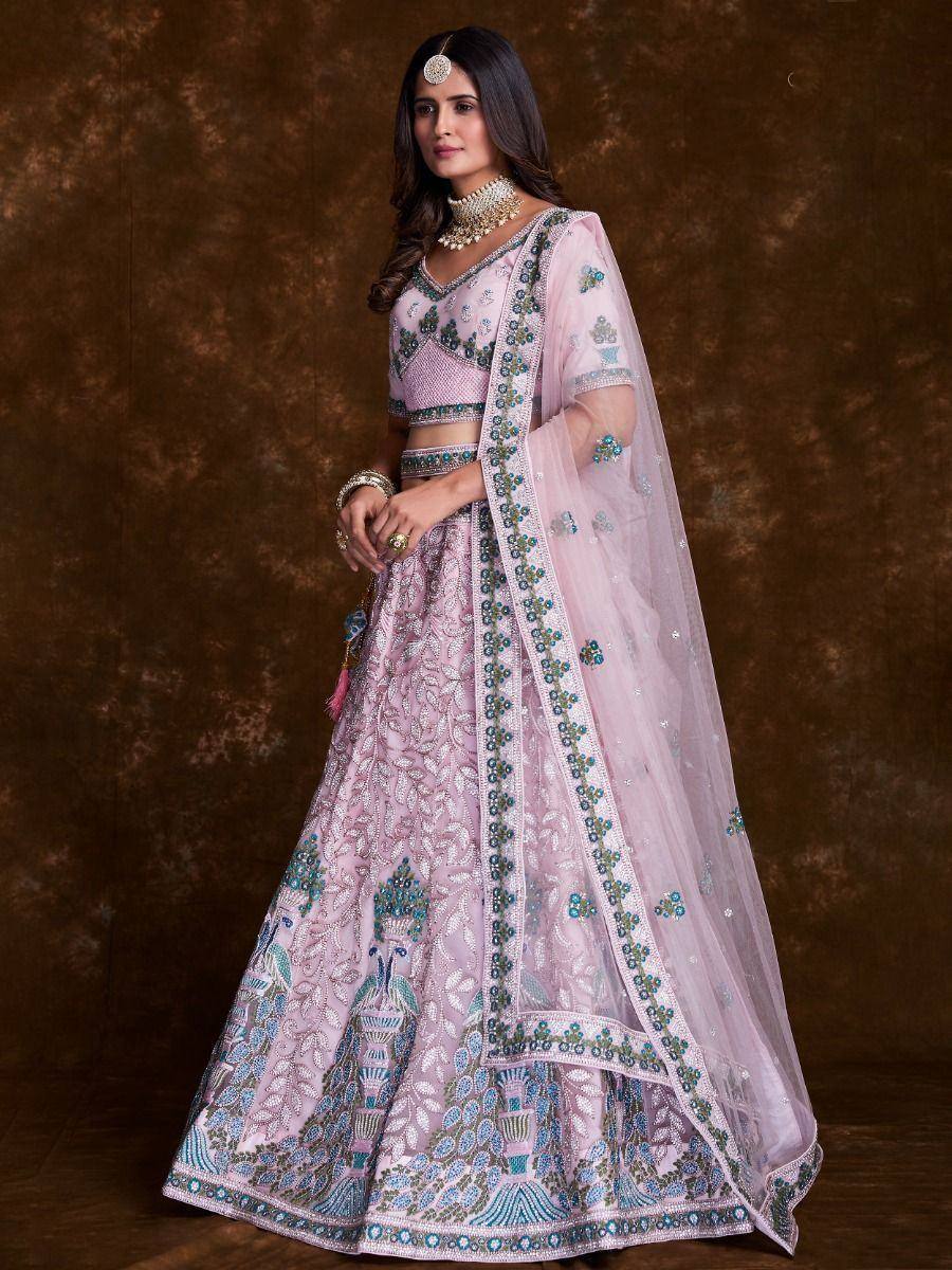 Pink embroidered lehenga choli with peacock motifs, perfect for Indian weddings and festive occasions