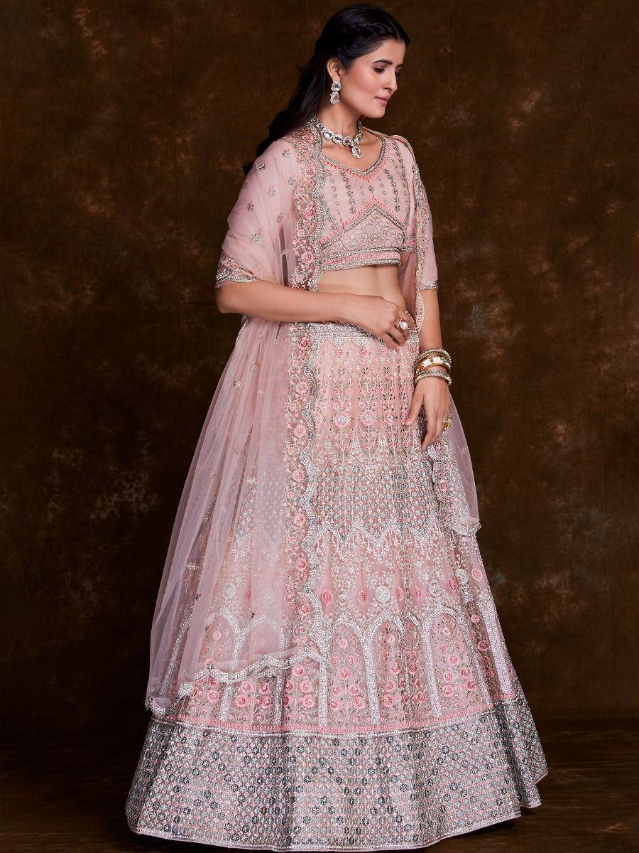 Pink embroidered lehenga choli with floral motifs, perfect for Indian weddings and festive occasions