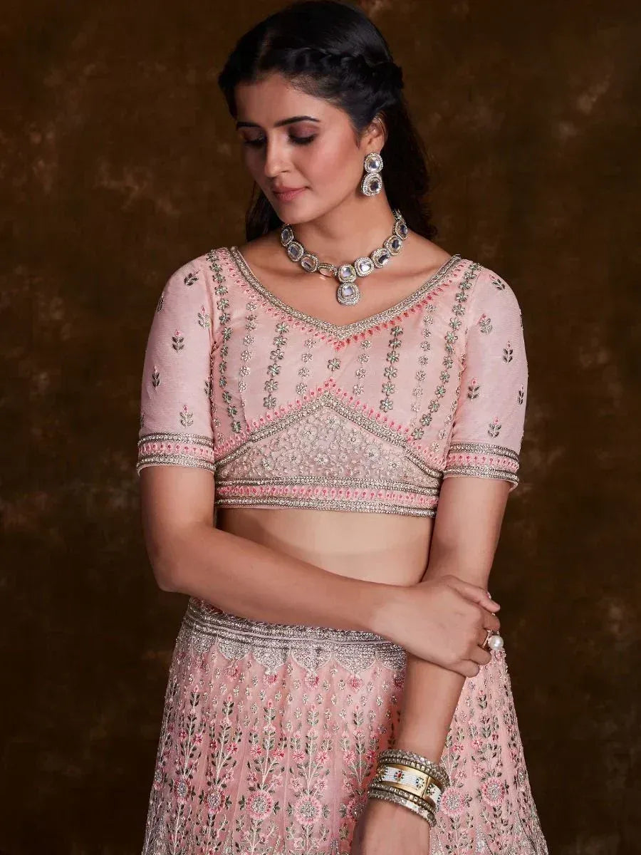 Pink embroidered lehenga choli with floral motifs and silver embellishments, perfect for Indian ethnic wear