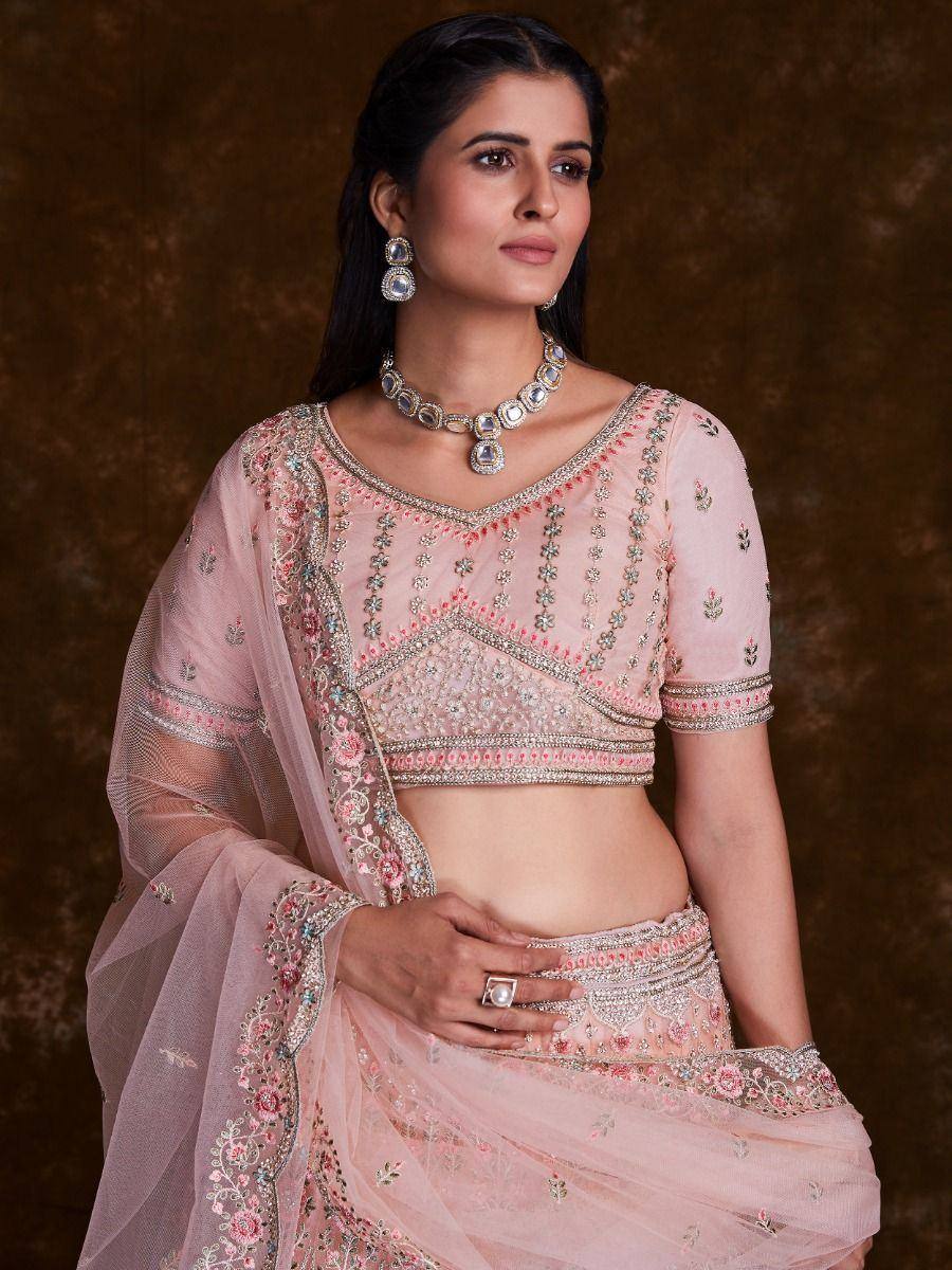 Pink embroidered lehenga choli with floral motifs and matching dupatta, perfect for Indian ethnic wear occasions