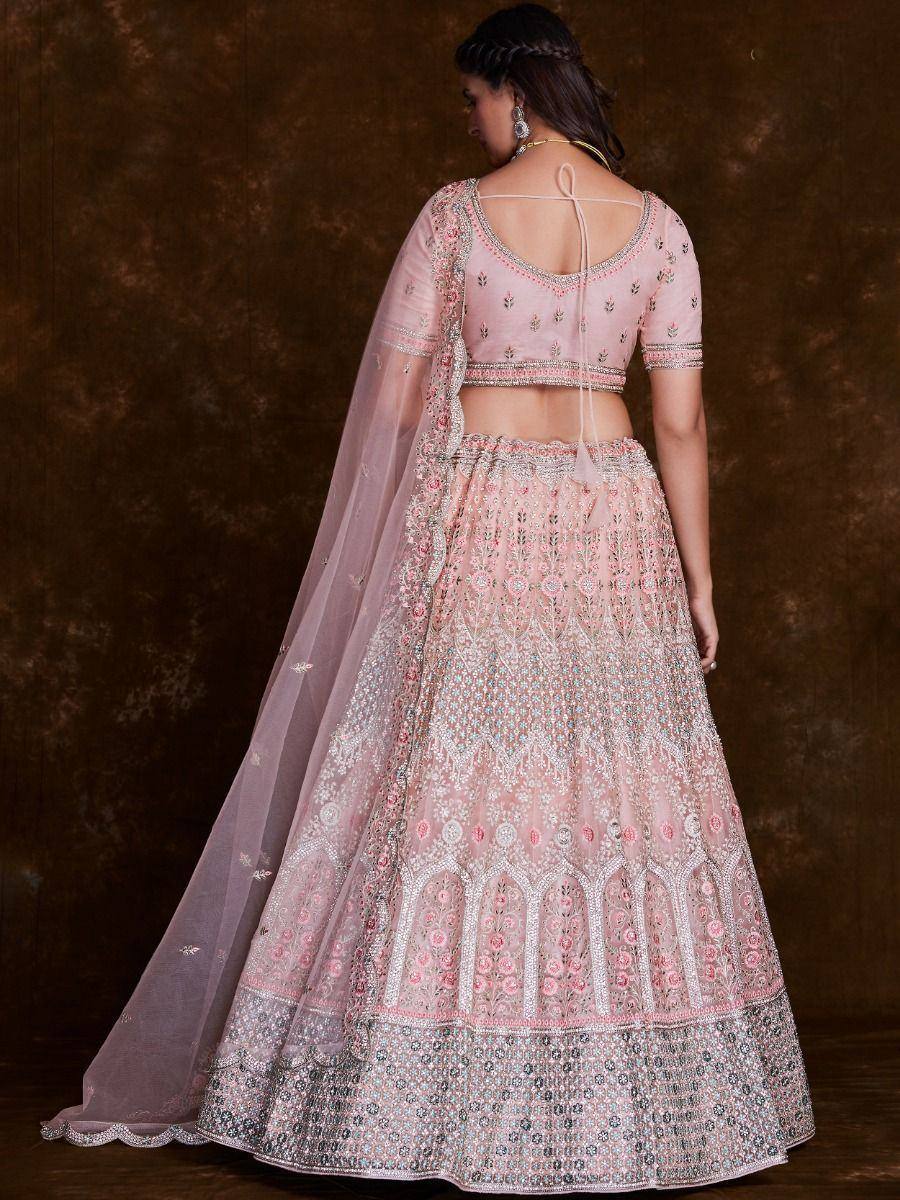 Pink embroidered lehenga choli with sheer dupatta, perfect for Indian weddings and festive occasions