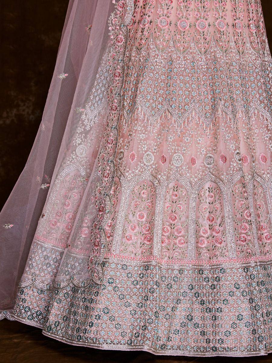 Pink embroidered lehenga with floral motifs and sheer dupatta, ideal for Indian ethnic wear occasions