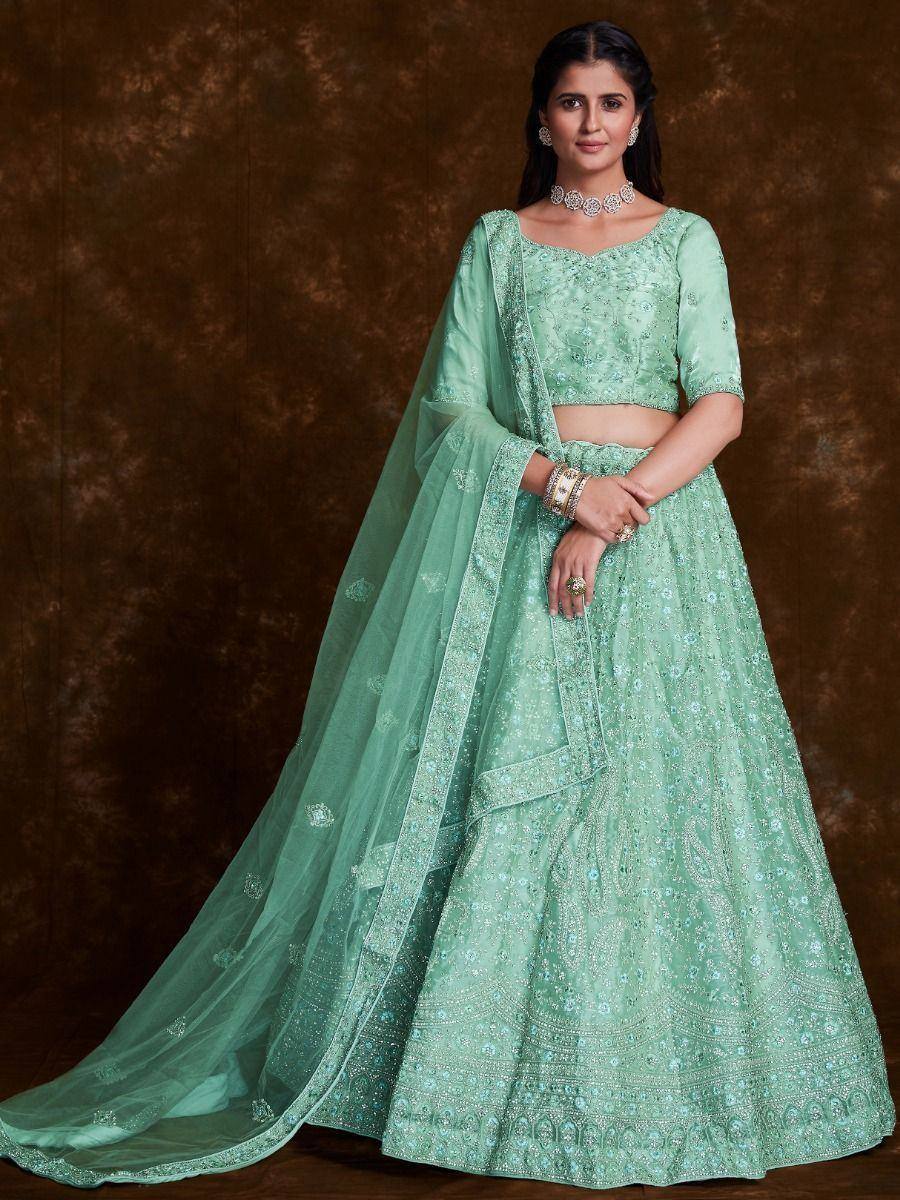 Mint green embroidered lehenga choli with sheer dupatta, perfect for Indian ethnic occasions