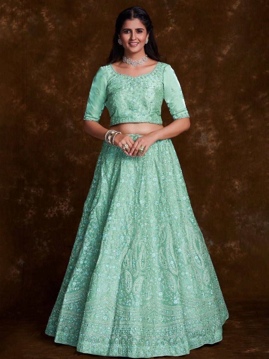 Mint green embroidered lehenga choli with floral motifs, perfect for Indian ethnic wear occasions