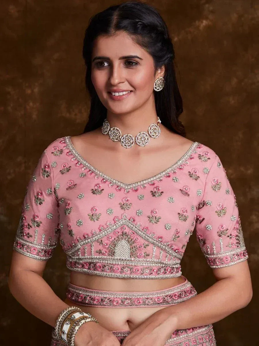 Pink embroidered lehenga choli with floral motifs and silver embellishments, perfect for Indian ethnic wear