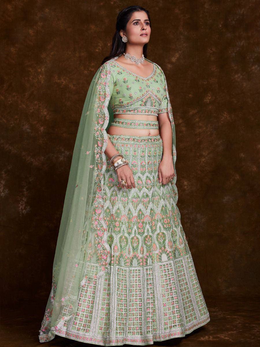 Mint green embroidered lehenga choli with floral motifs and sheer dupatta, perfect for Indian ethnic occasions
