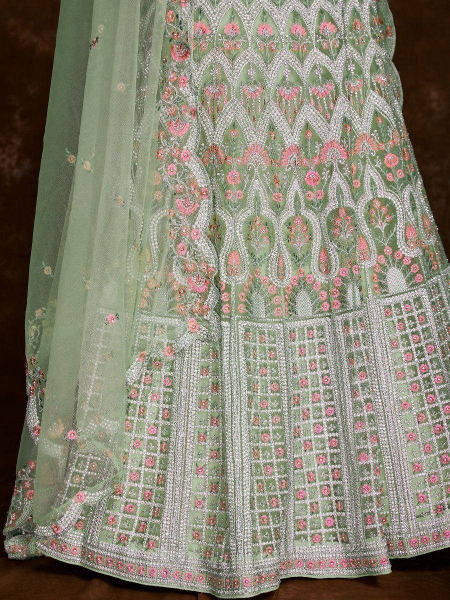 Mint green lehenga with pink floral embroidery and silver beadwork, perfect for Indian ethnic wear occasions.