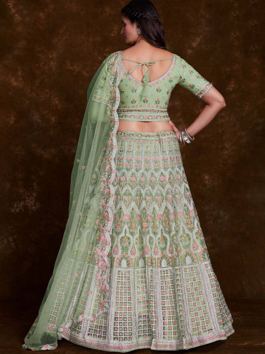 Mint green embroidered lehenga choli with floral motifs and sheer dupatta, perfect for Indian ethnic occasions