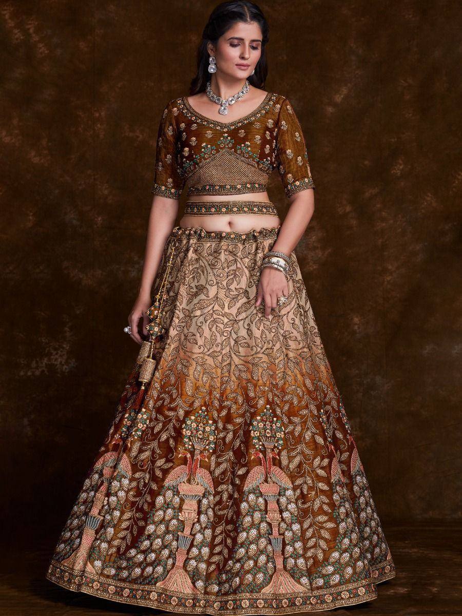 Elegant Indian lehenga choli with intricate peacock embroidery and gold detailing, perfect for weddings and festivals.