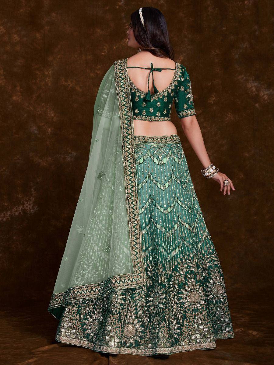 Emerald green designer lehenga choli with gold embroidery and sheer dupatta, ethnic Indian wear