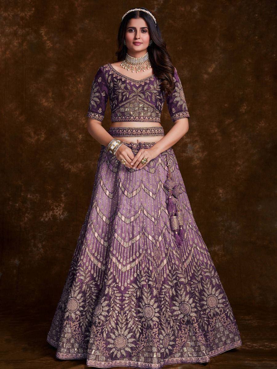Purple designer lehenga choli with gold embroidery, perfect for Indian weddings and festive occasions
