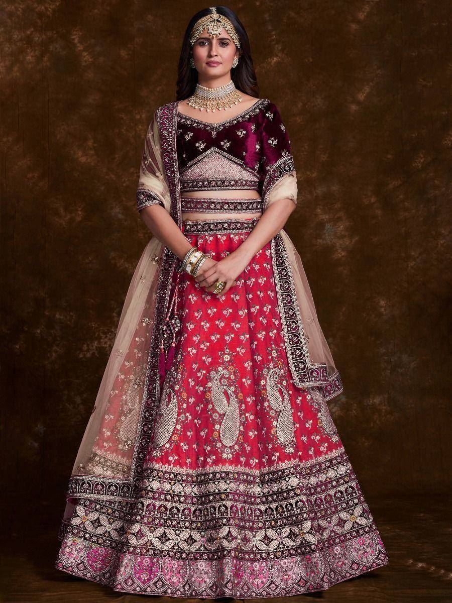 Elegant maroon and pink embroidered lehenga choli with heavy embellishments and dupatta, perfect for weddings