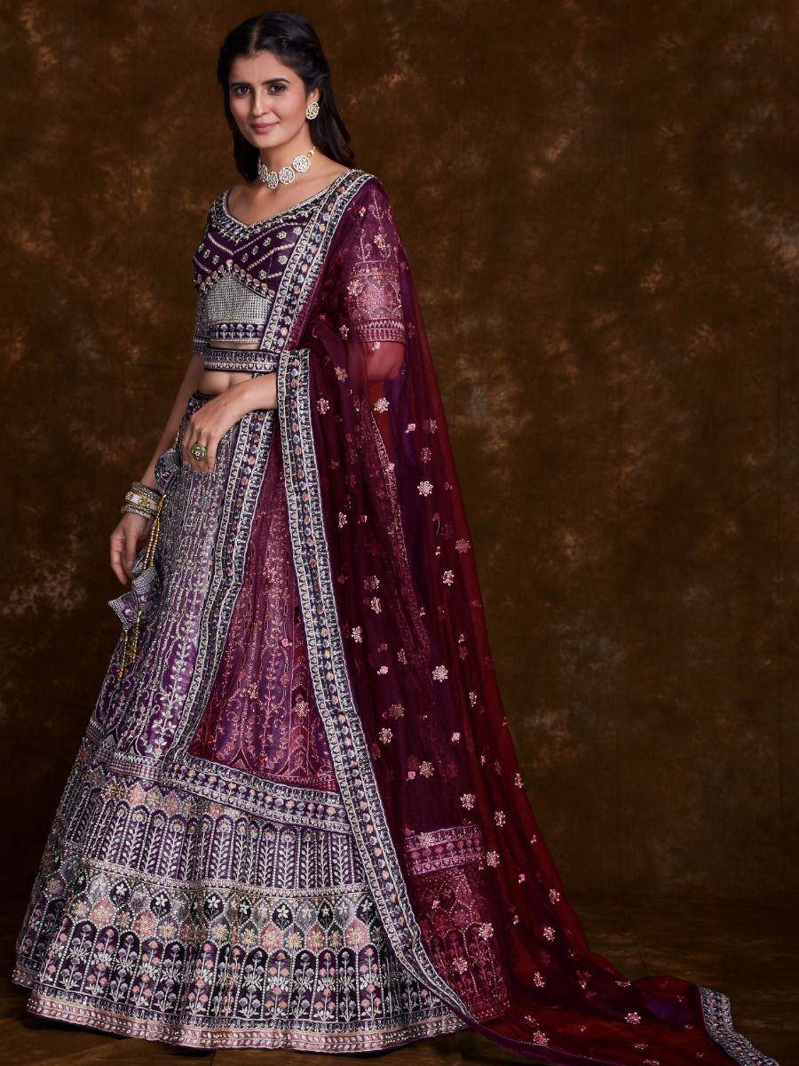 Elegant maroon lehenga choli with intricate embroidery and matching dupatta, perfect for Indian ethnic occasions.
