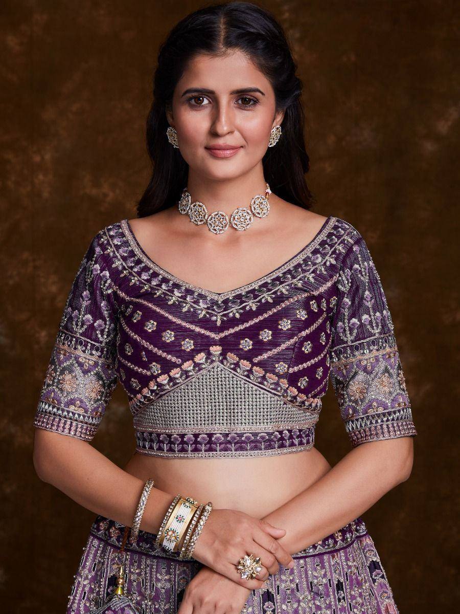 Purple embroidered lehenga choli with silver detailing, perfect for Indian ethnic wear and festive occasions.