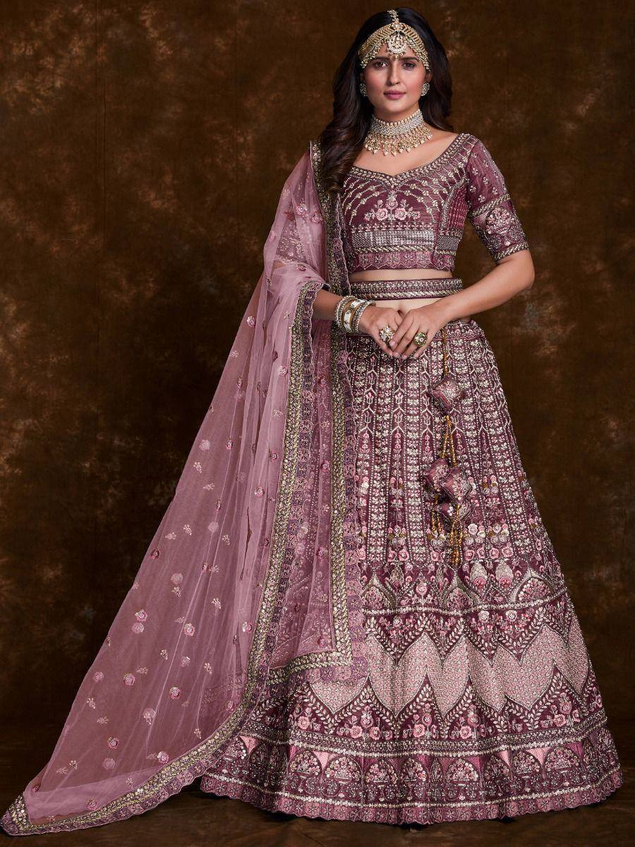Elegant maroon lehenga choli with intricate gold embroidery and matching dupatta, perfect for Indian weddings and festive occasions.