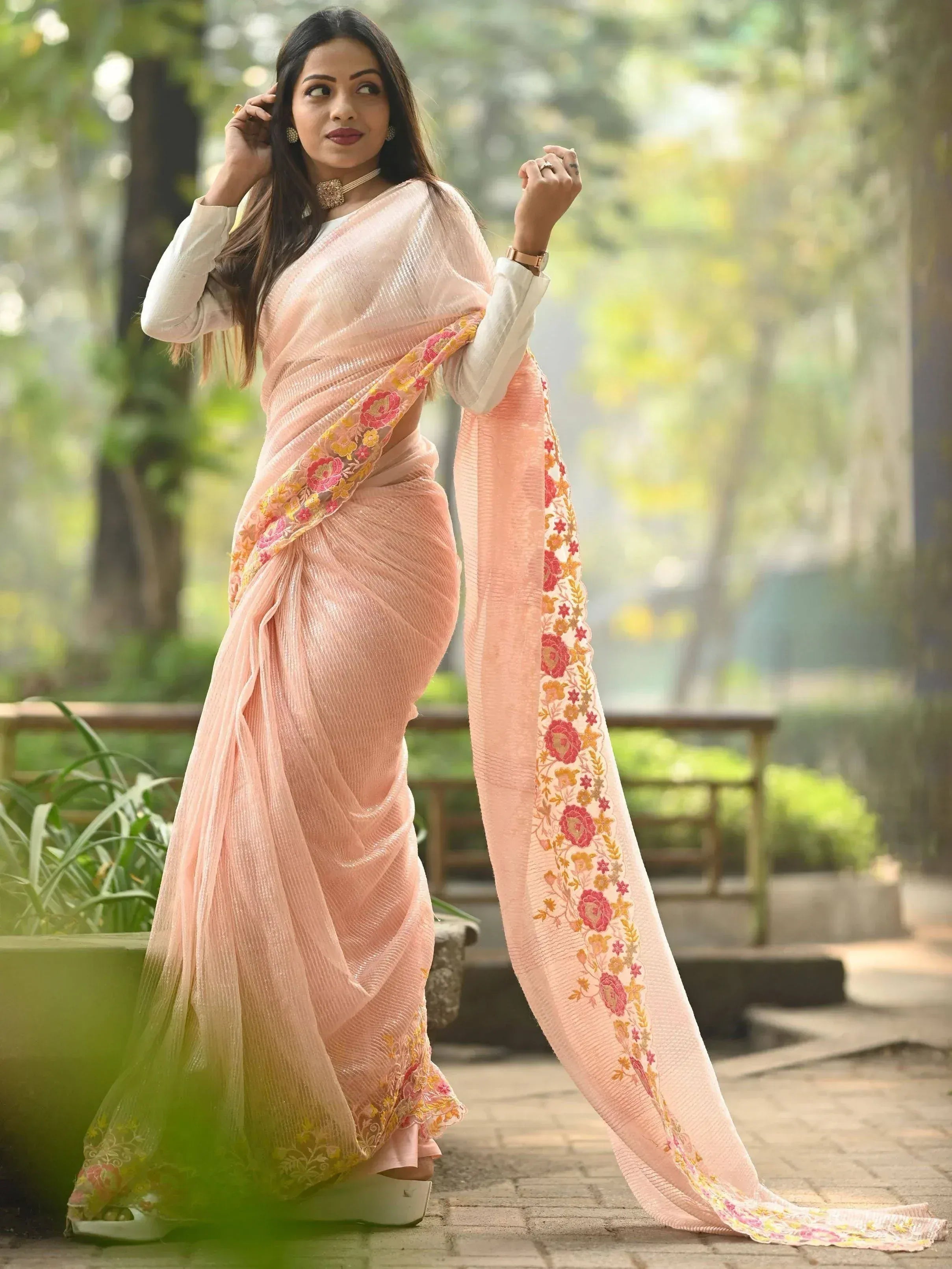 Pink floral embroidered saree with white blouse, perfect for Indian ethnic wear occasions
