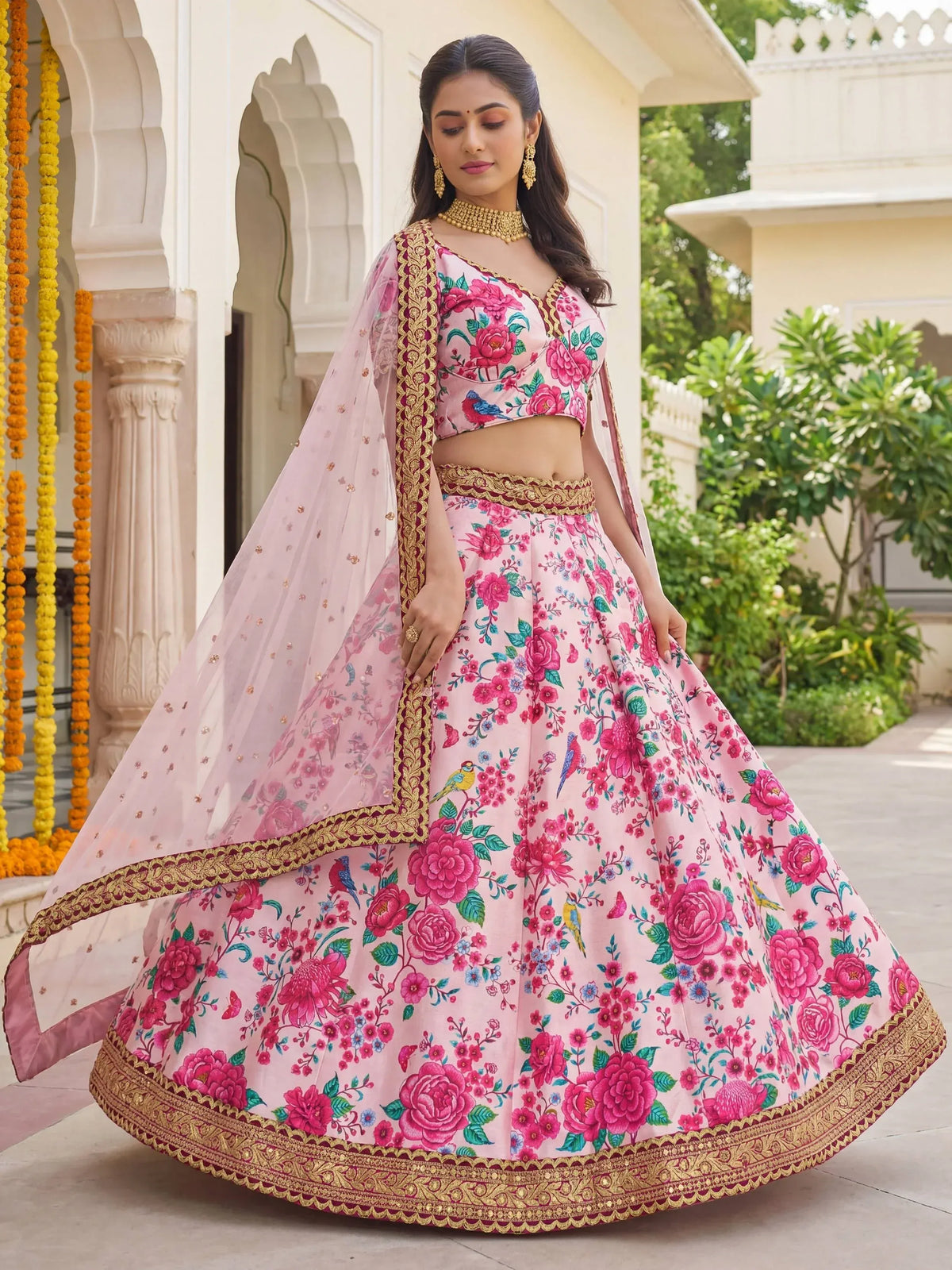 Pink floral lehenga choli with gold embroidery, perfect for Indian weddings and festive occasions