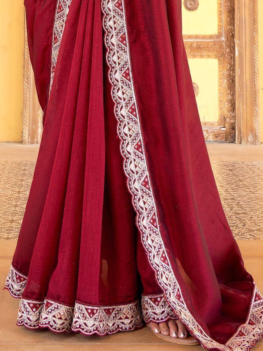 Maroon ethnic saree with white embroidered border, traditional Indian wear