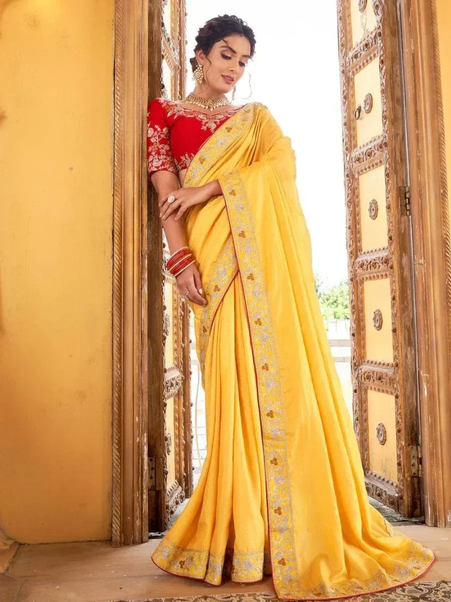 Yellow embroidered saree with red blouse, ethnic Indian wear for weddings and festivals