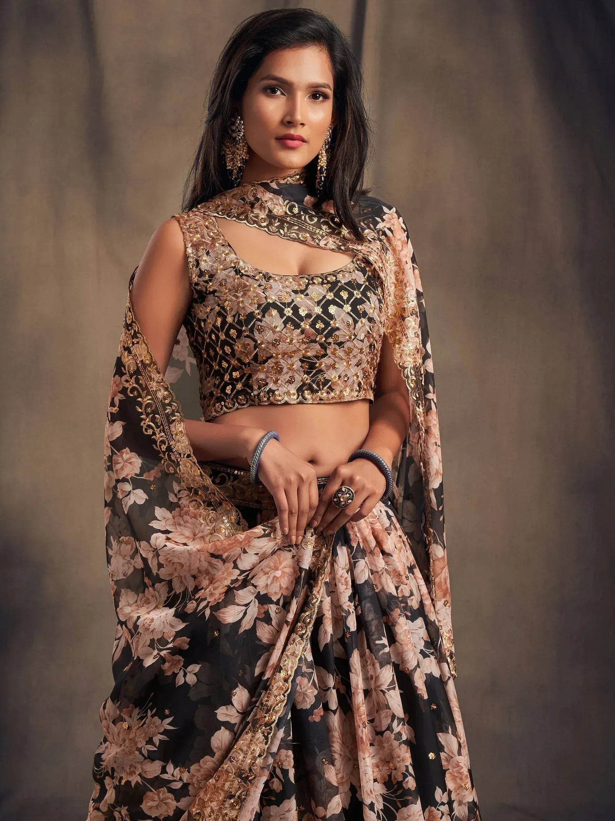 Elegant black floral lehenga choli with gold embroidery and sheer dupatta for Indian ethnic wear