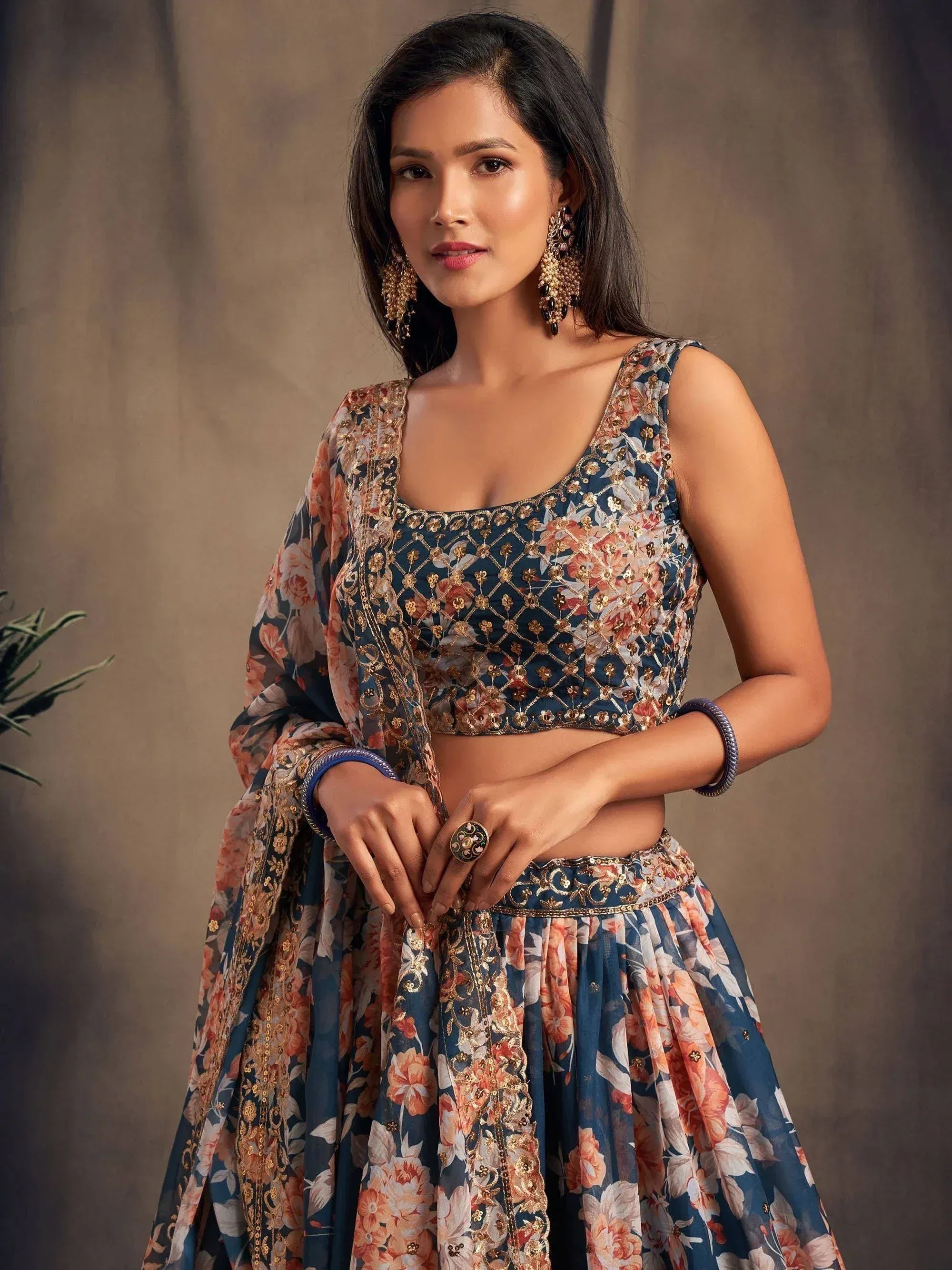 Blue floral lehenga choli with gold embroidery, perfect for Indian ethnic wear and festive occasions.
