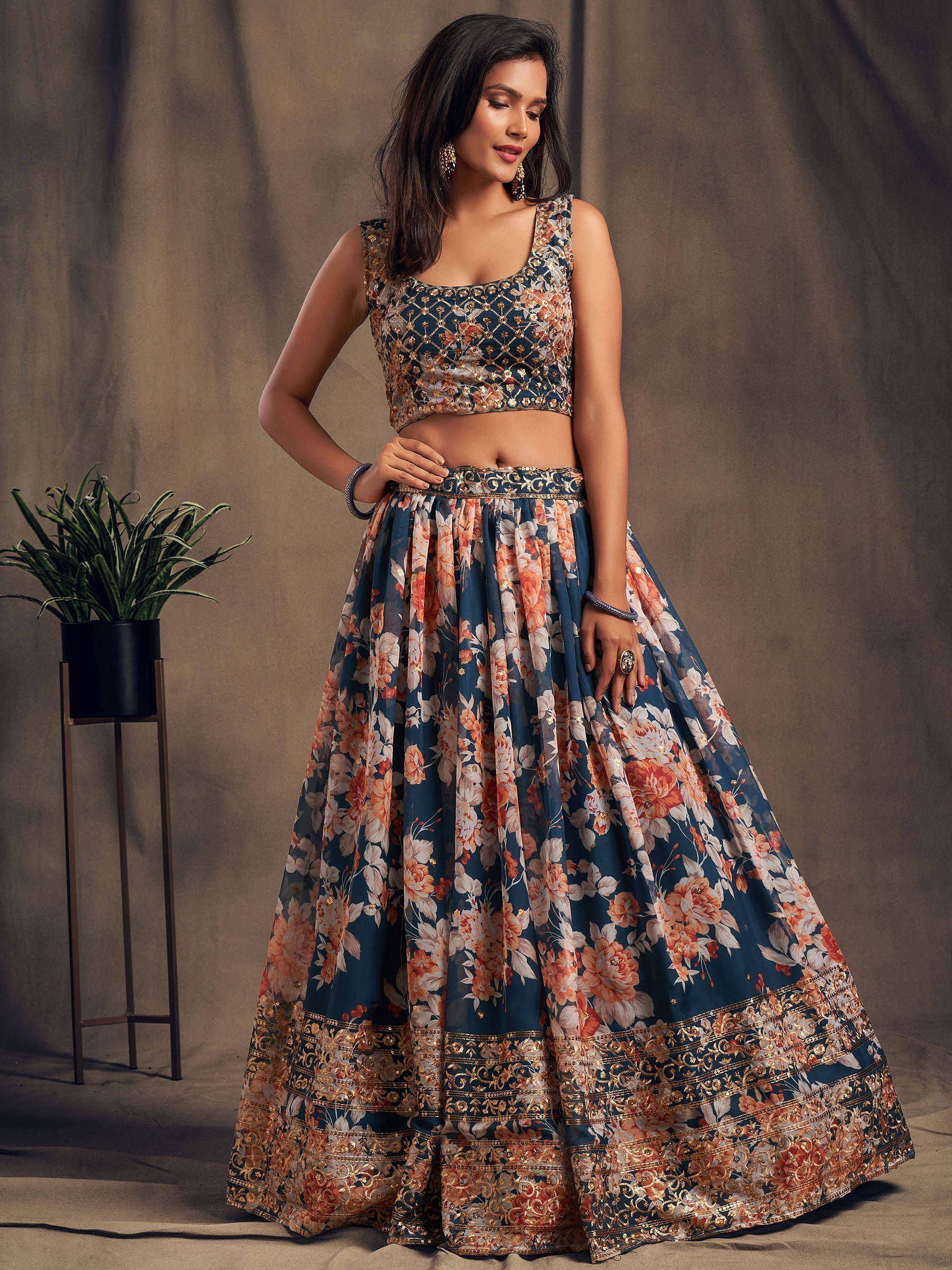 Elegant floral lehenga choli with intricate embroidery and golden borders for Indian ethnic wear