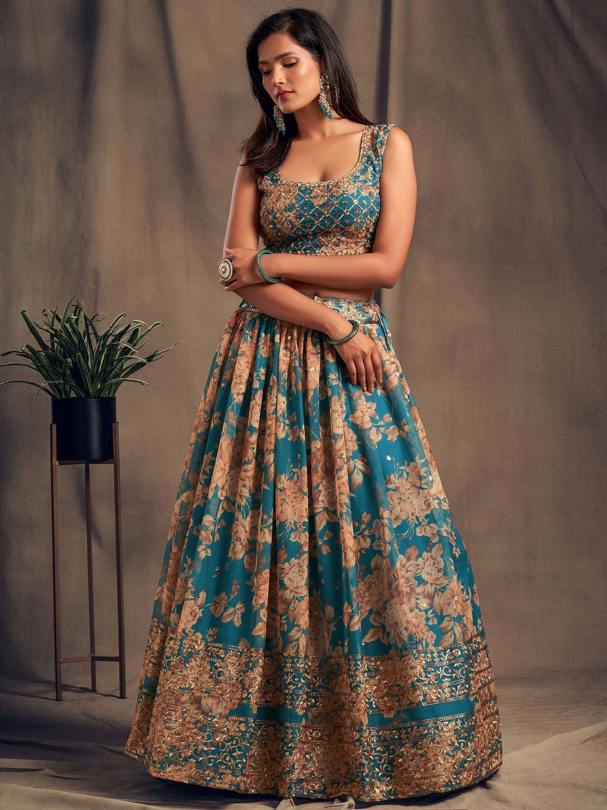 Teal floral lehenga choli with gold embroidery, perfect for Indian weddings and festive occasions
