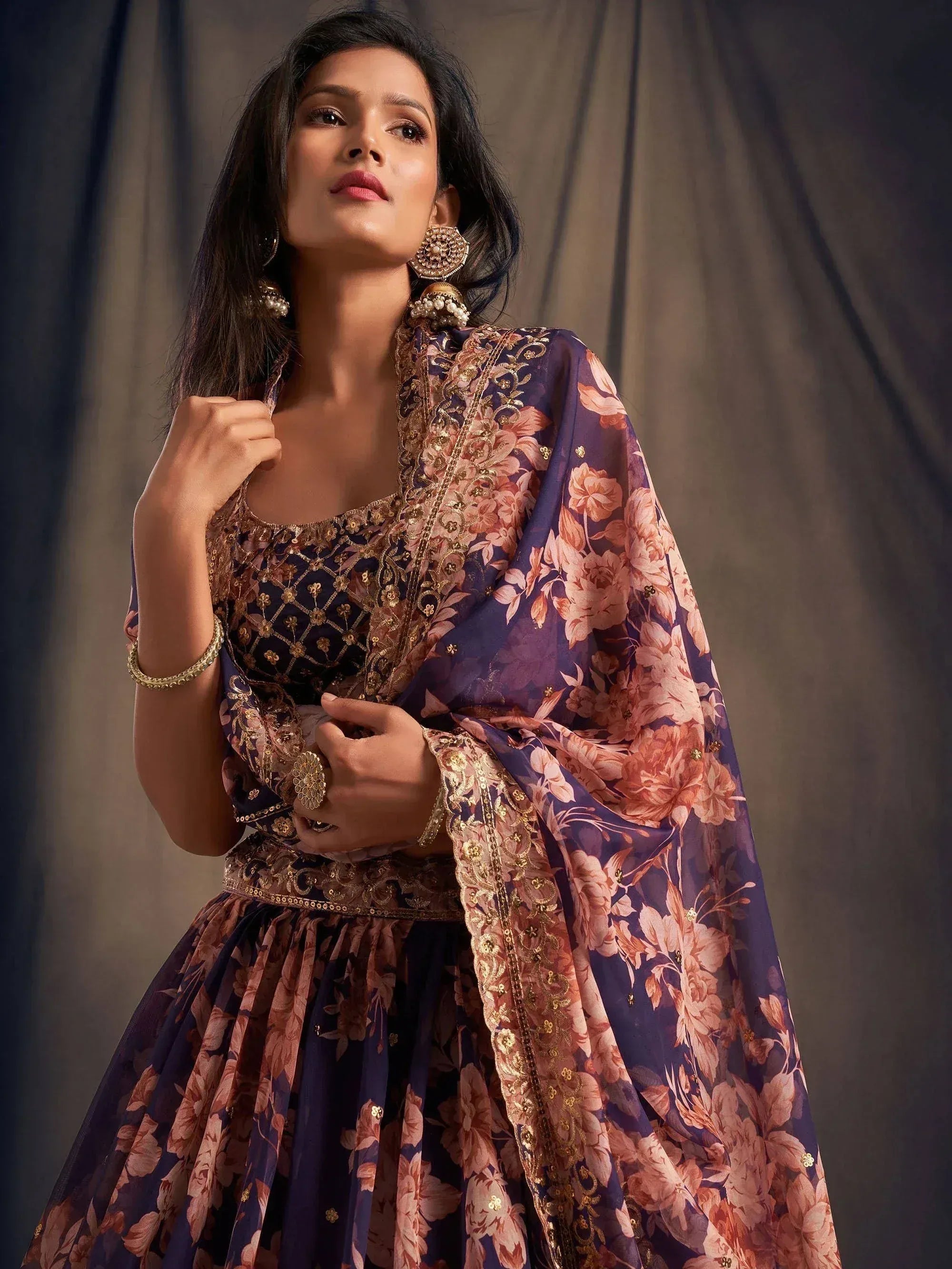 Elegant purple floral lehenga choli with gold embroidery, perfect for Indian ethnic wear occasions