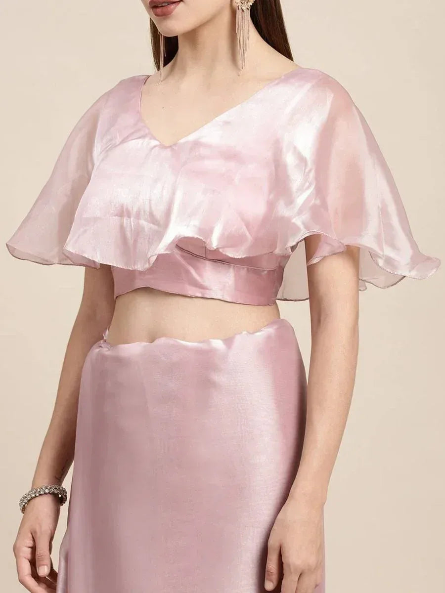 Pink satin ethnic gown with ruffled cape top and high-waist skirt, perfect for Indian festive occasions
