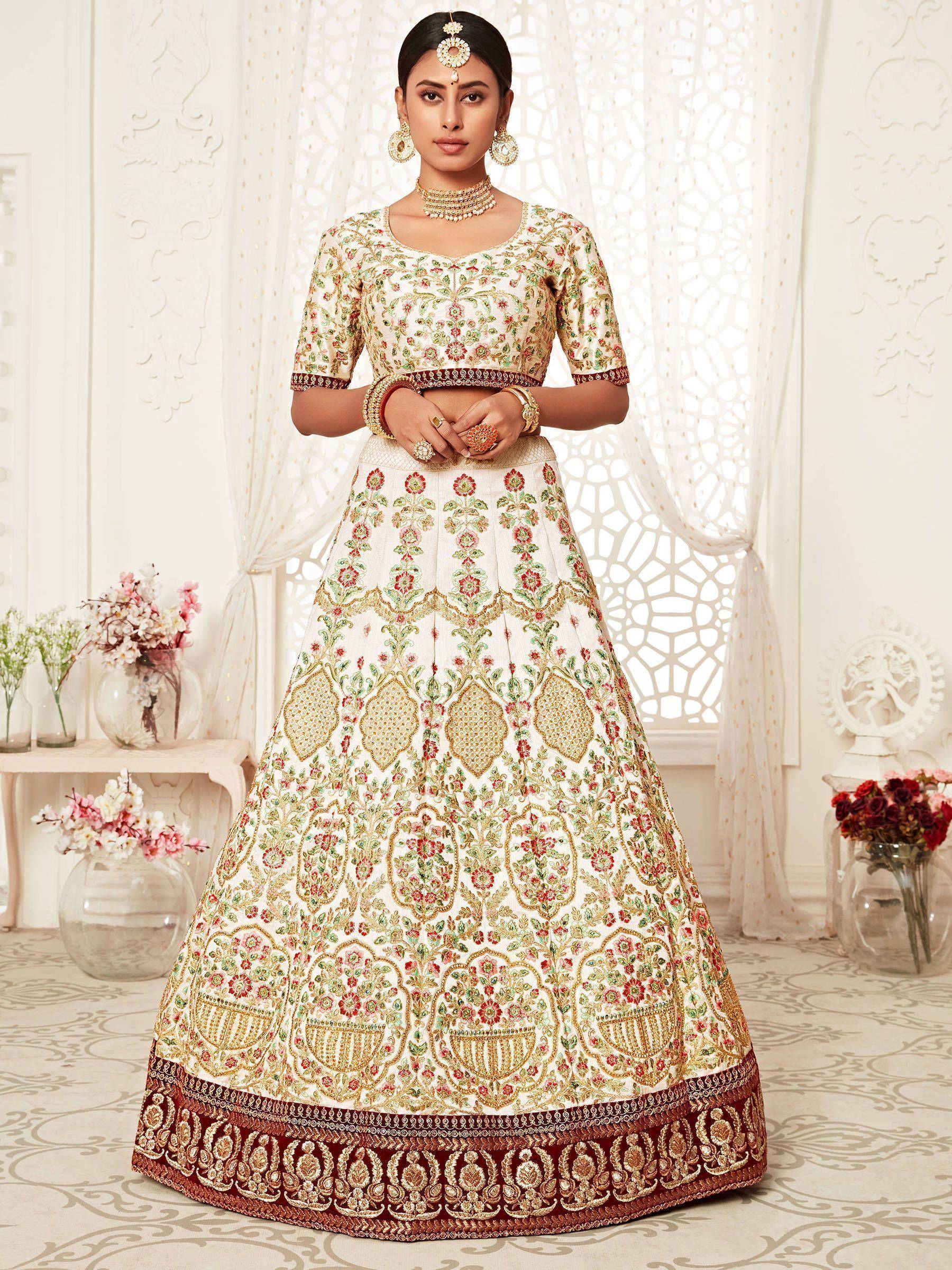 Elegant ivory lehenga choli with floral embroidery, perfect for Indian weddings and festive occasions.