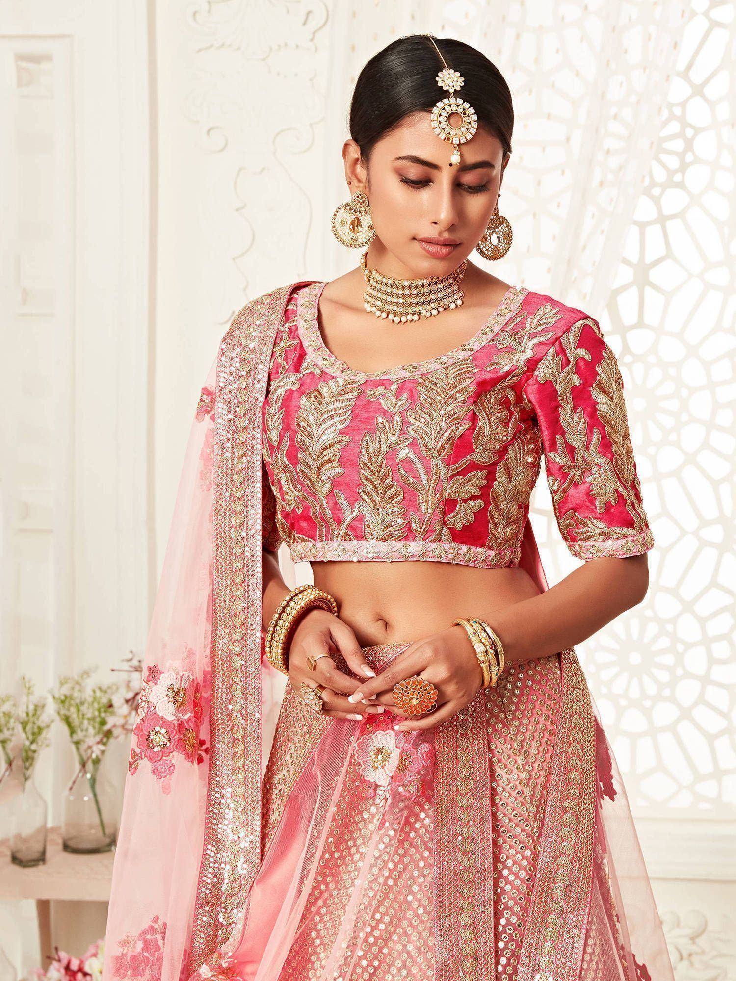 Pink embroidered lehenga choli with gold detailing, perfect for Indian weddings and festive occasions