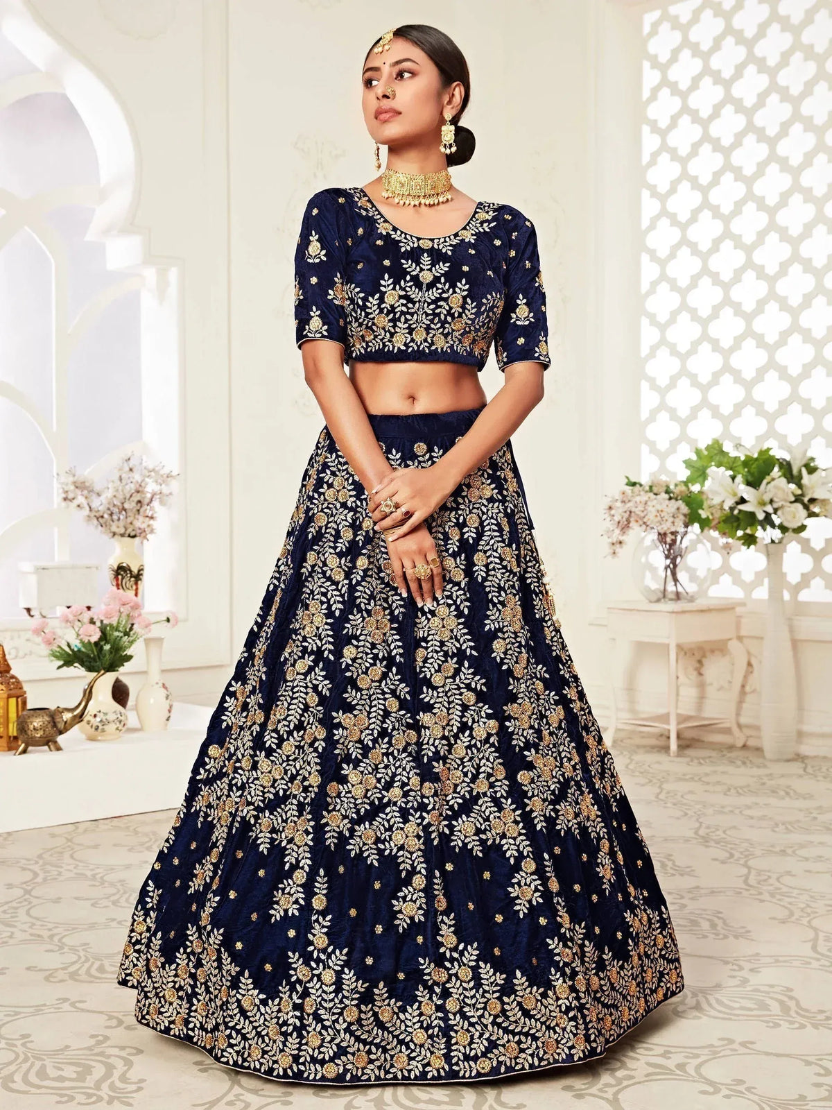 Navy blue embroidered lehenga choli with gold floral work, perfect for Indian weddings and festive occasions