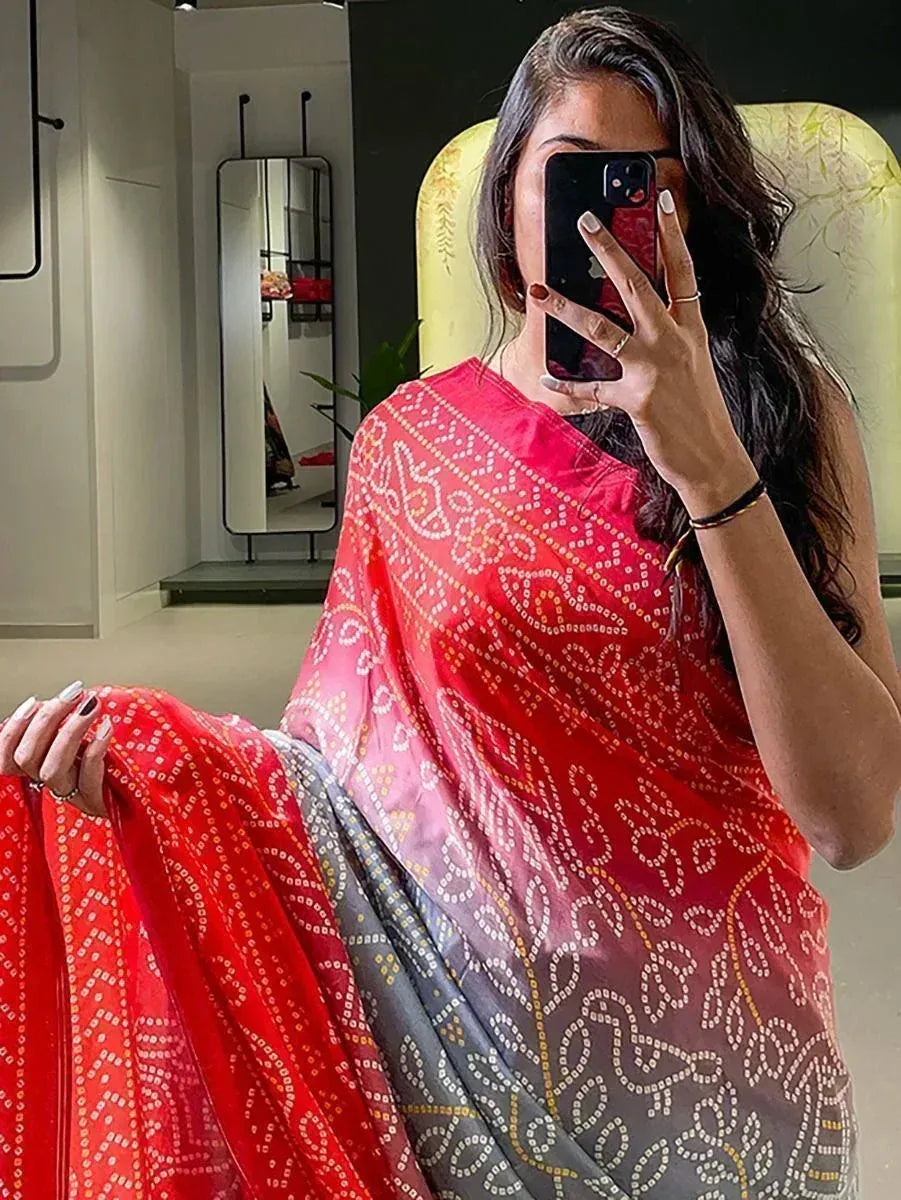 Red and gray printed saree with intricate patterns, perfect for ethnic wear occasions.