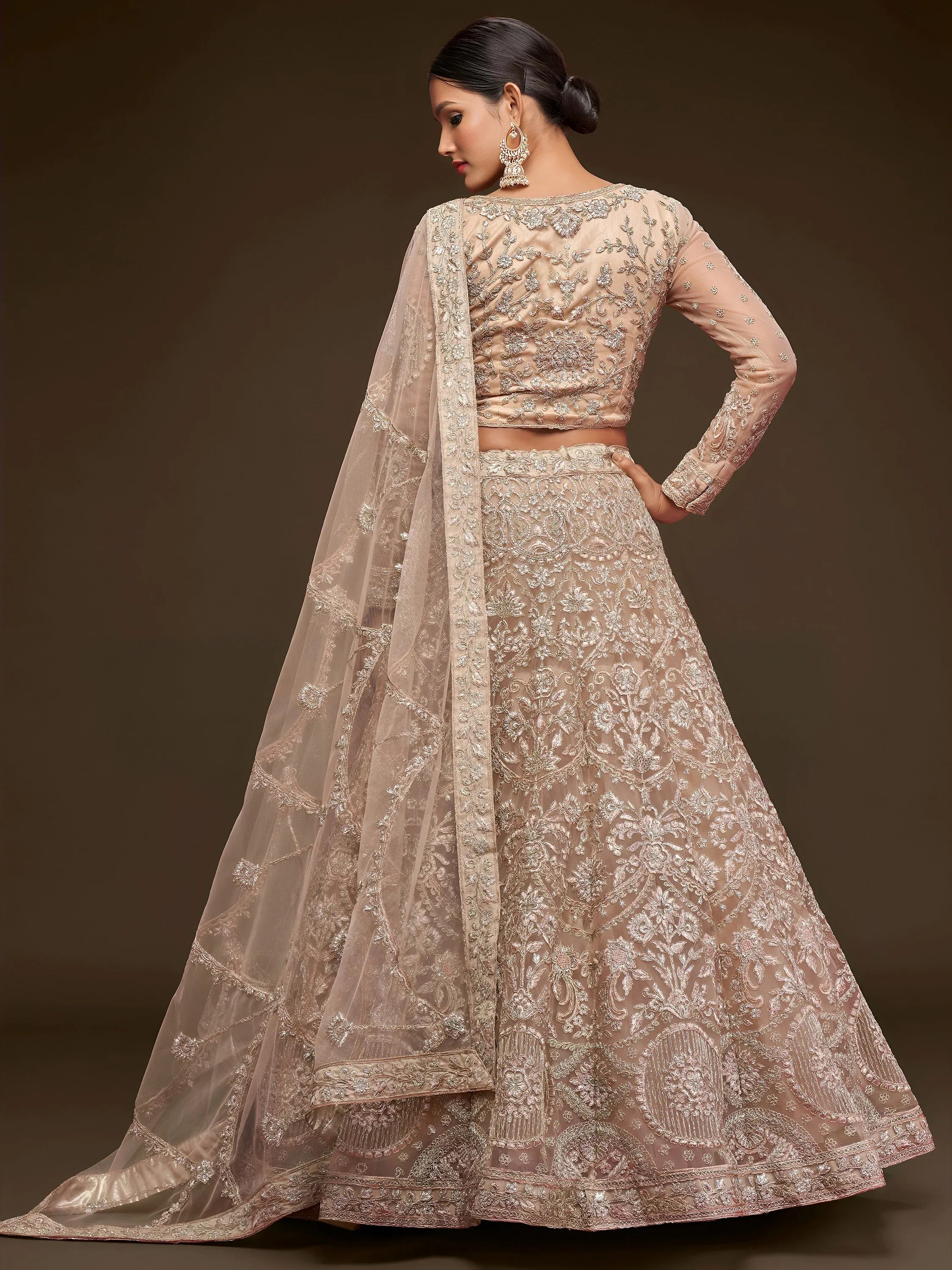 Ravishing Beige Embroidered Soft Net Ceremony Wear Lehenga Choli