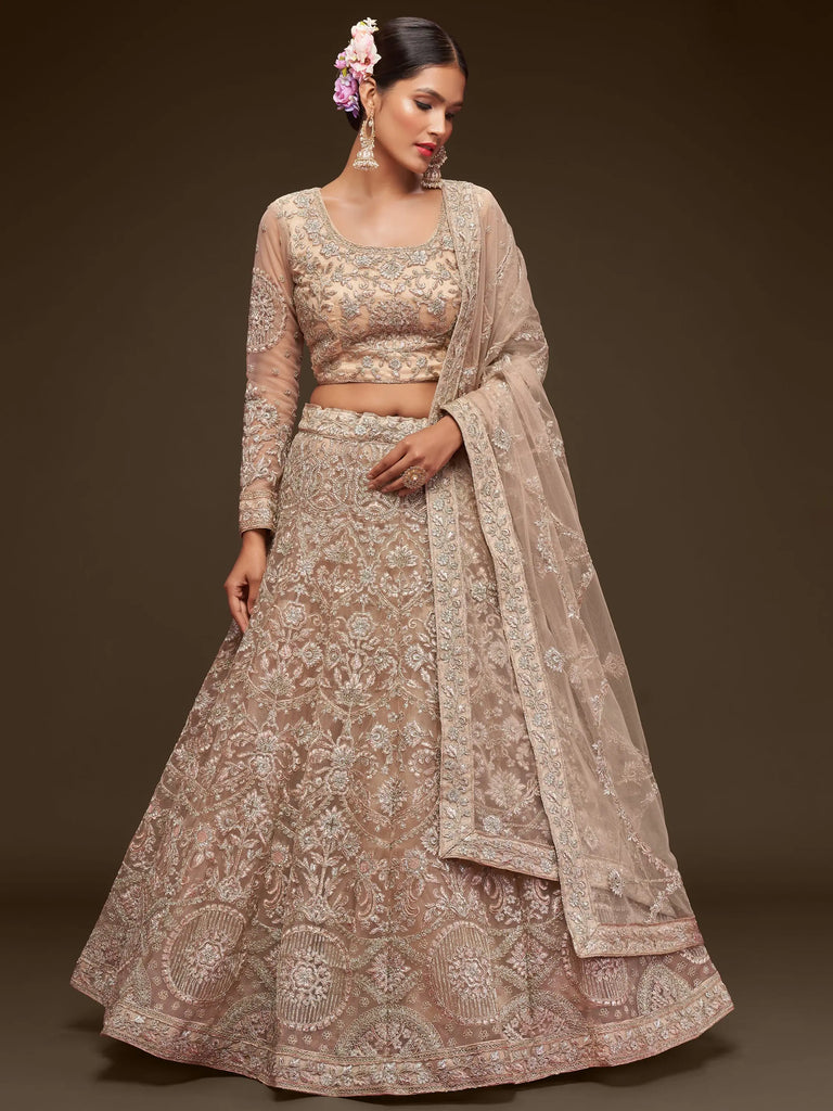 Ravishing Beige Embroidered Soft Net Ceremony Wear Lehenga Choli