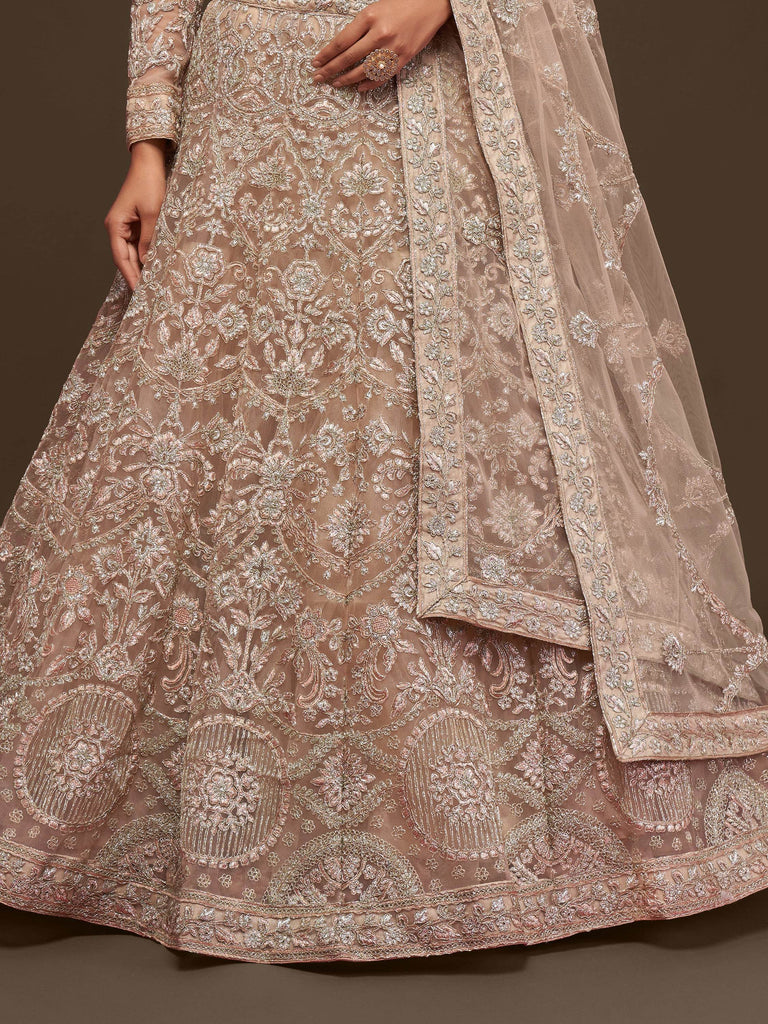 Ravishing Beige Embroidered Soft Net Ceremony Wear Lehenga Choli