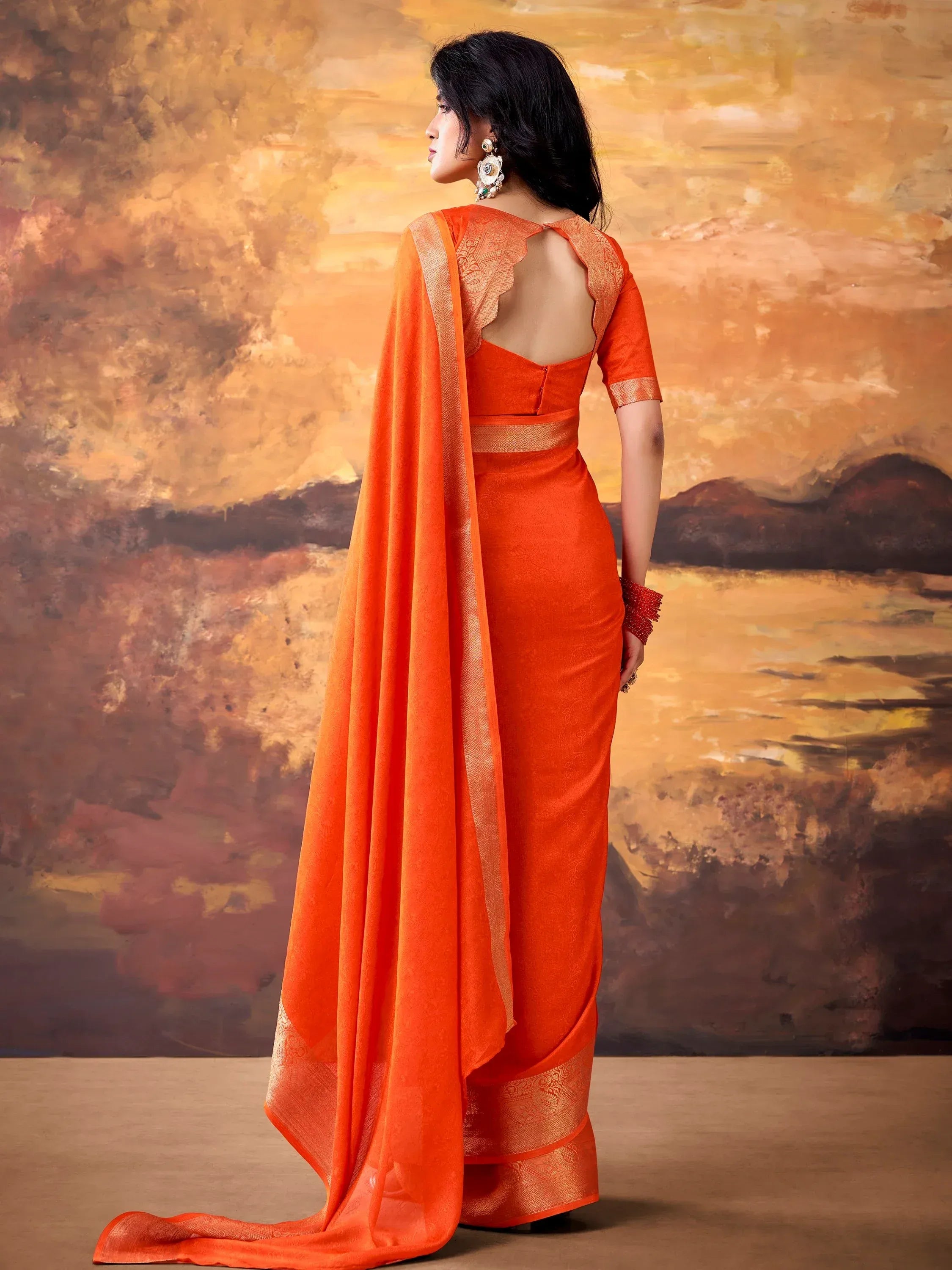 Elegant Orange Zari Weaving Georgette Festive Wear Saree With Blouse