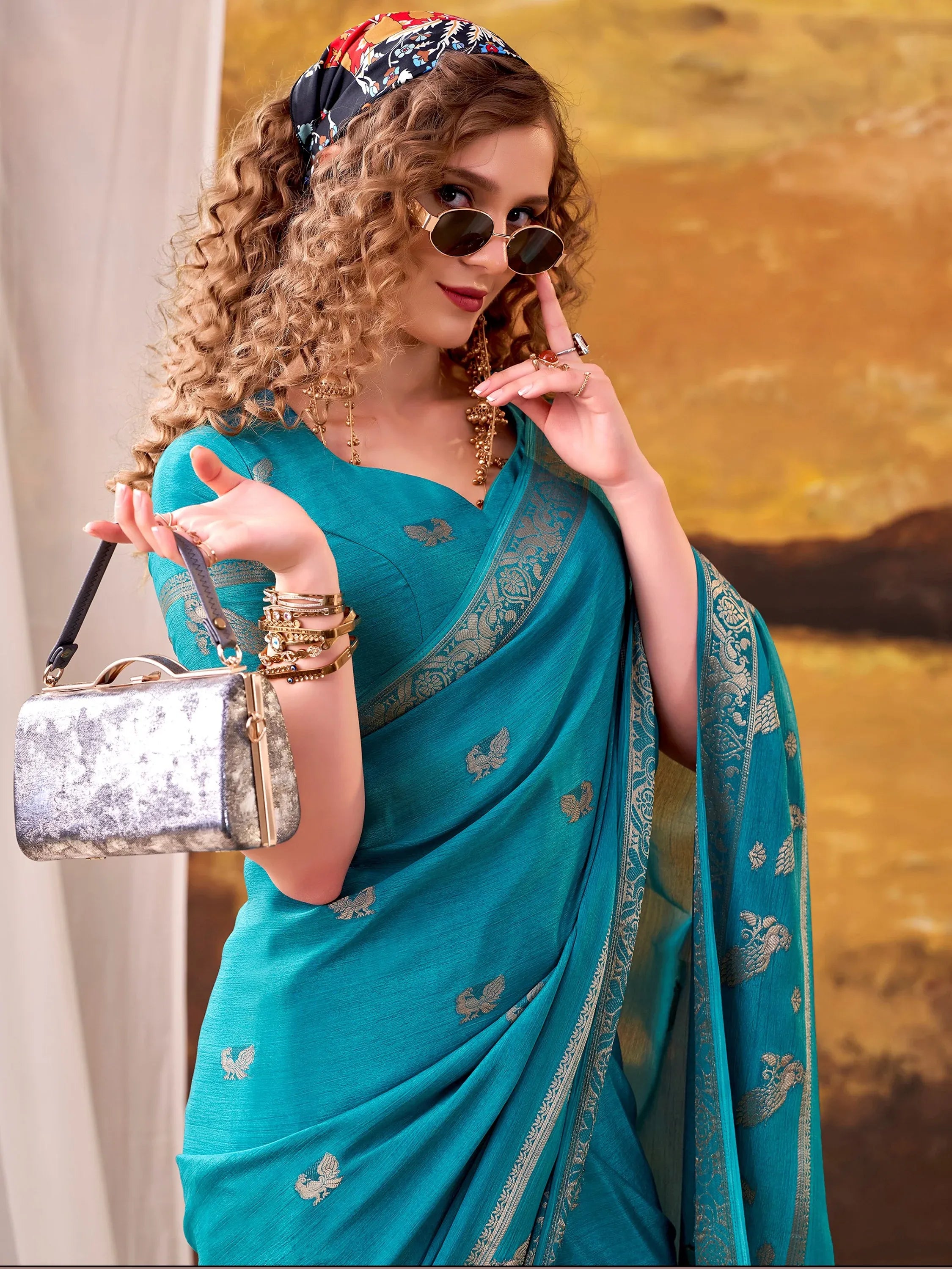Ravishing Teal Blue Zari Weaving Crepe Casual Wear Saree With Blouse